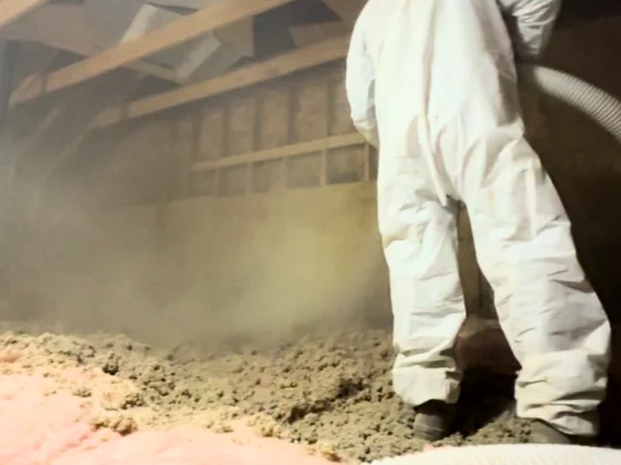 Attic insulation being blown in