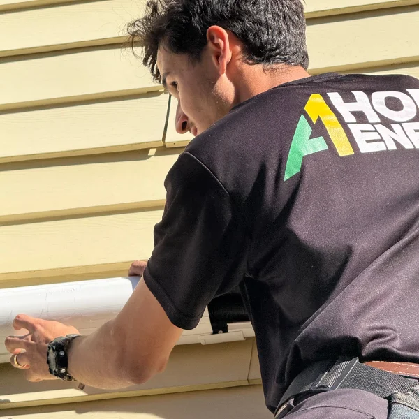 Technician inspecting exterior conduit as part of an efficiency plan